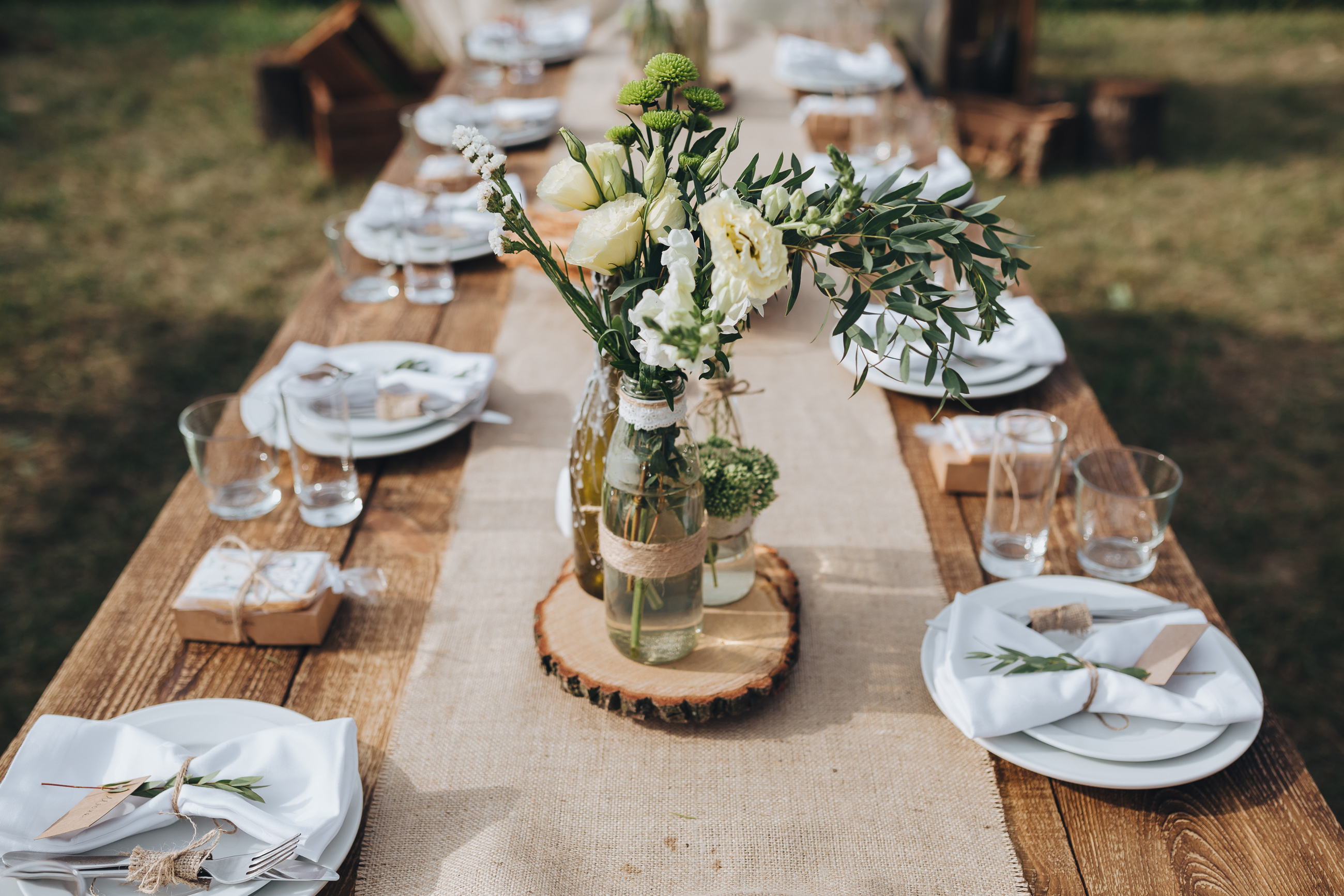 Rustic Engagements - This is often a popular centerpiece amongst our  clients with the wood slab and different variations of decor and/or florals  to make a statement on our couples guest tables!