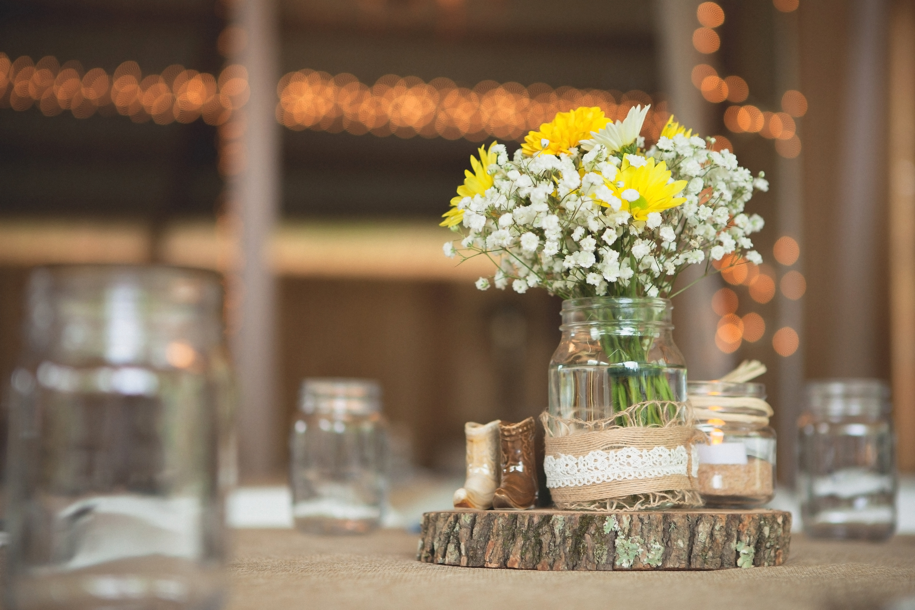 There's something so cute and simple about a mason jar filled with flowers. Check out all of these country barn reception decor ideas. 