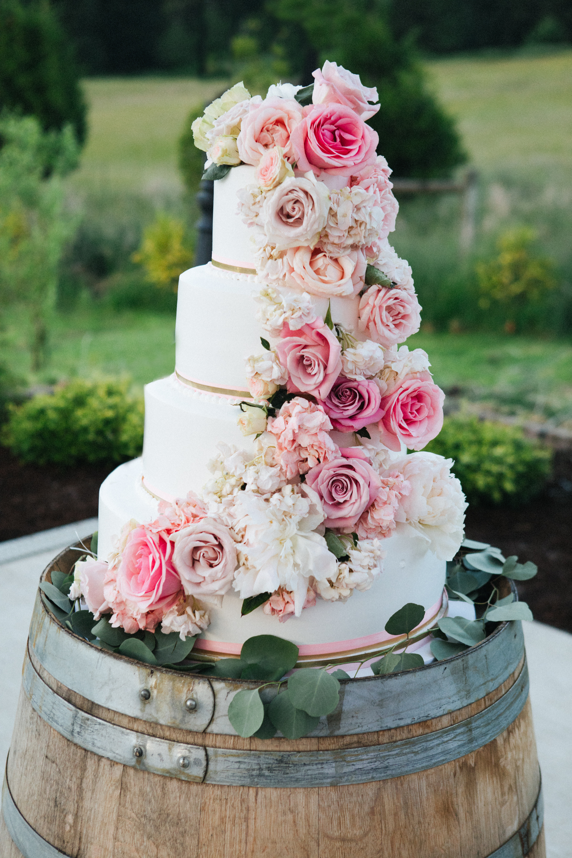 Did you know that wooden barrels make the perfect cake stand? Look here for all of our country barn reception decor ideas. You'll love them.