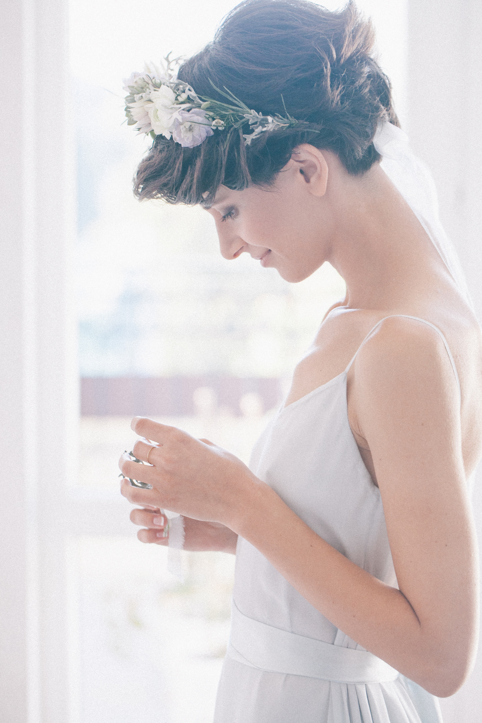 If you have short hair, it can be hard to style it for your wedding. Try adding a flower crown to your look. It will make you feel like a princess. 