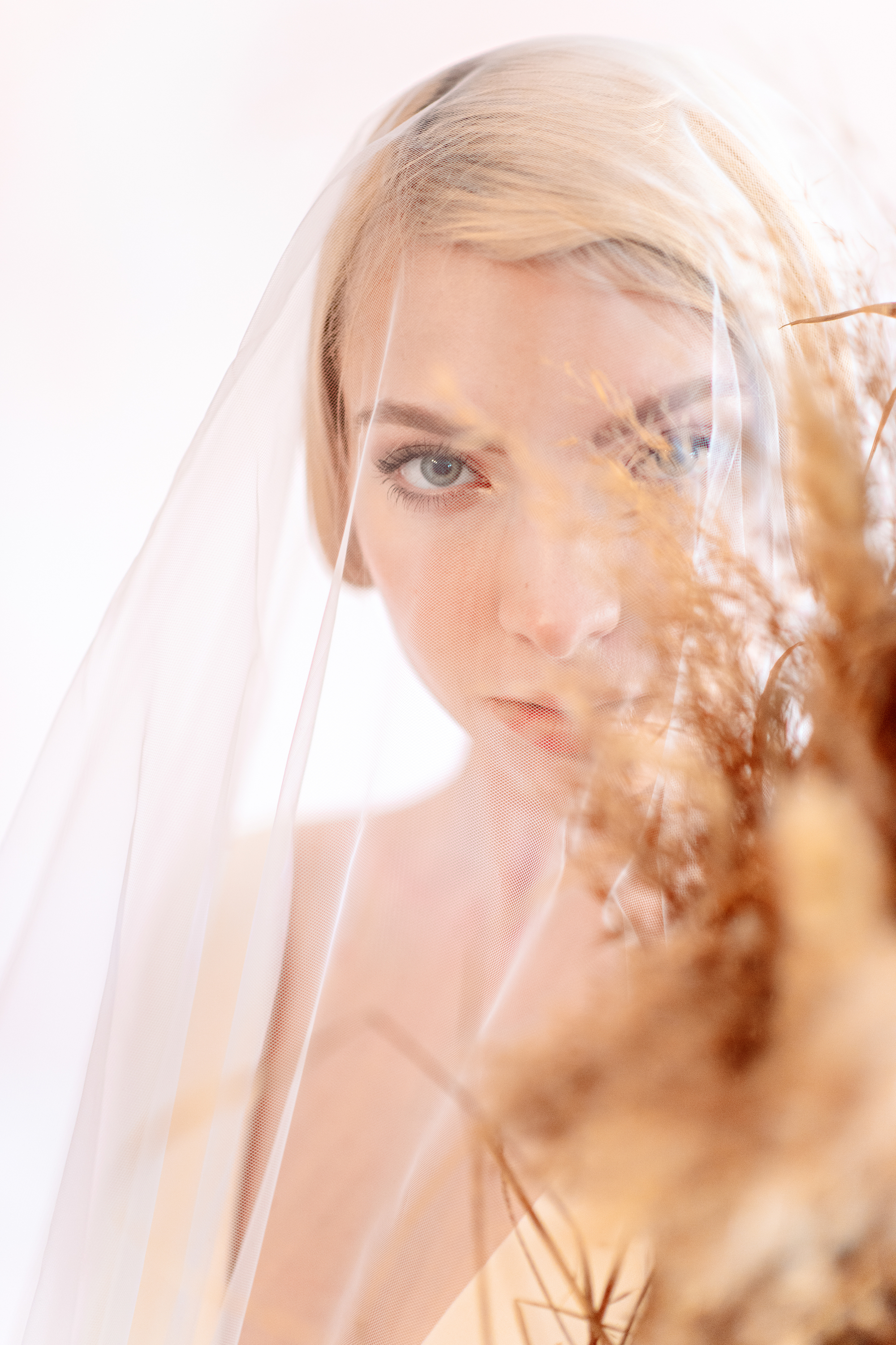 If you're not sure how to style your hair for your wedding because you have straight hair, just add a classic veil. It will take the focus off of your hair. 