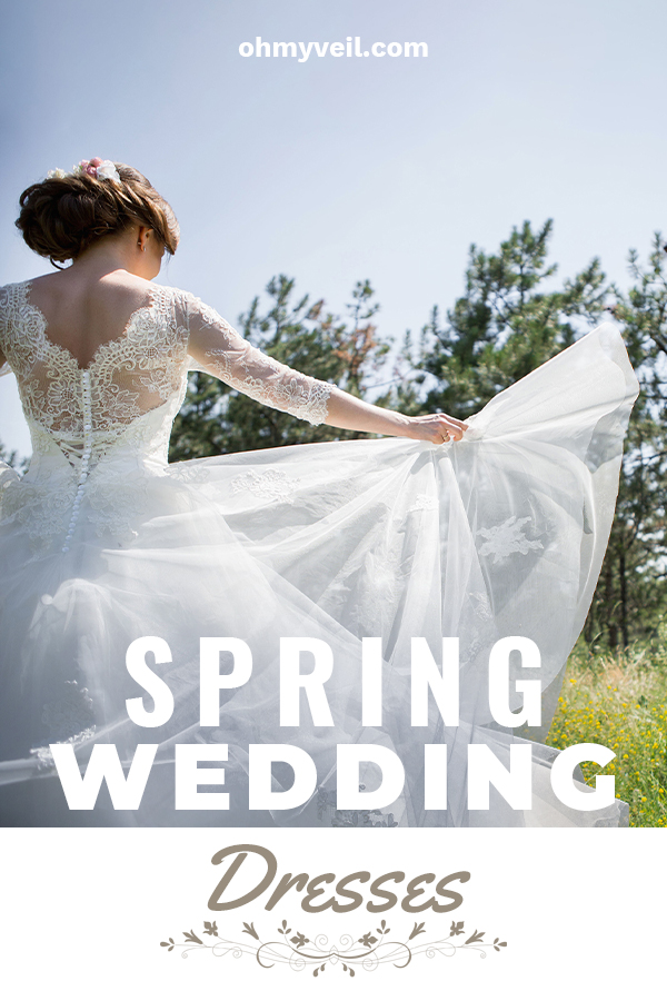 A spring wedding dress has to represent what spring does. It should be light, airy, and simply stunning. That's what we are featuring in this article. Take a look at these dresses that are stunning. Ideas for dresses with lace, sleeves, ballgown styles and more. Enjoy some color with pink that creates a whimsical look. Maybe tulle is your thing? Embrace the beauty of spring with a dress that is equally refreshing as a spring day. #springweddingdresses #weddingtips 