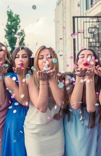 Bridal Shower Ideas. Bridal Shower themes for spring. Bride to be and friends blowing round paper confetti