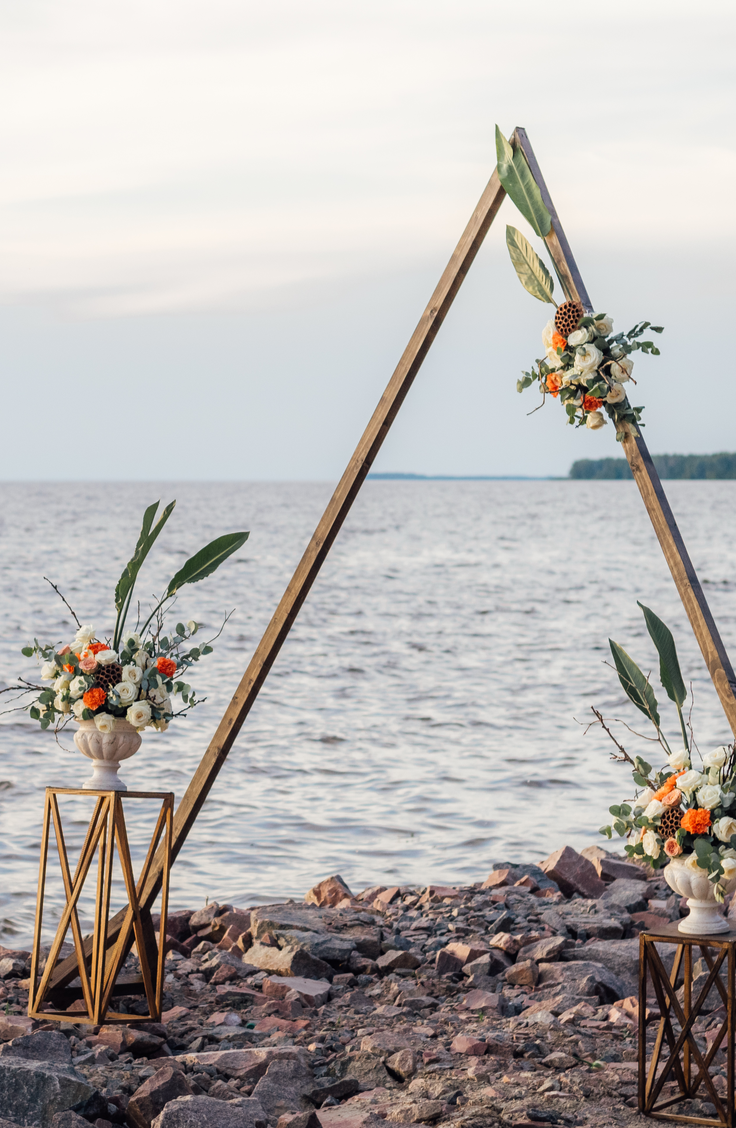 Whether you choose to do your ceremony under one, or if you just want one to take photos under, a DIY wedding arch is a must-have for any bride this year. You can even do a fun shape like a triangle! 